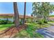 Well-maintained single-story home with lush landscaping, mature trees, and a welcoming entrance at 5376 Royal Palm Ave # 5376, Sarasota, FL 34234