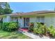 Charming front entrance with decorative door, well-maintained landscaping, and clear address number at 5376 Royal Palm Ave # 5376, Sarasota, FL 34234