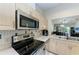 Kitchen with stainless steel appliances, neutral countertops, and connected living spaces at 5376 Royal Palm Ave # 5376, Sarasota, FL 34234