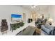 Bright living room with tile floors, ceiling fan, and comfortable seating area at 5376 Royal Palm Ave # 5376, Sarasota, FL 34234