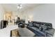 Spacious living room featuring tile flooring, neutral walls, and open access to dining area at 5376 Royal Palm Ave # 5376, Sarasota, FL 34234