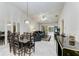Open concept living room featuring stylish tile floors, adjacent dining area and sliding door access at 5376 Royal Palm Ave # 5376, Sarasota, FL 34234
