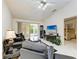 Inviting living room with comfortable seating and view of the adjacent bedroom through the doorway at 5376 Royal Palm Ave # 5376, Sarasota, FL 34234