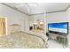 Main bedroom with a four-poster bed, dresser, and television at 5376 Royal Palm Ave # 5376, Sarasota, FL 34234