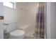 Clean bathroom with shower stall, toilet and built-in seat at 5807 Garden Lakes Fern # 5807, Bradenton, FL 34203