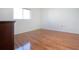 Bright bedroom featuring hardwood floors and a large window at 5807 Garden Lakes Fern # 5807, Bradenton, FL 34203