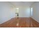 Spacious bedroom with hardwood floors and access to a bathroom at 5807 Garden Lakes Fern # 5807, Bradenton, FL 34203