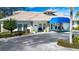 Community clubhouse with covered entryway and landscaping at 5807 Garden Lakes Fern # 5807, Bradenton, FL 34203