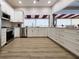 Modern kitchen with white cabinets and stainless steel appliances at 5807 Garden Lakes Fern # 5807, Bradenton, FL 34203