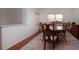 Bright dining room with hardwood floors and charming window treatments at 5807 Garden Lakes Fern # 5807, Bradenton, FL 34203
