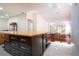 Kitchen boasts a large island with seating, stainless steel appliances, and ample storage at 5807 Garden Lakes Fern # 5807, Bradenton, FL 34203