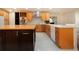 Gourmet kitchen features an expansive island and top-of-the-line appliances at 5807 Garden Lakes Fern # 5807, Bradenton, FL 34203