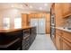 Updated kitchen with an island, stainless steel appliances, and ample counter space at 5807 Garden Lakes Fern # 5807, Bradenton, FL 34203