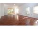Bright living room featuring hardwood floors and sliding glass doors at 5807 Garden Lakes Fern # 5807, Bradenton, FL 34203