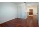 Bedroom with wood floors and views into dining area at 5807 Garden Lakes Fern # 5807, Bradenton, FL 34203