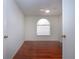 Bedroom with wood floors and arched window, allowing in plenty of natural light at 5807 Garden Lakes Fern # 5807, Bradenton, FL 34203