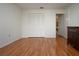 Bedroom with wood floors and double door closet at 5807 Garden Lakes Fern # 5807, Bradenton, FL 34203