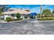 Community clubhouse with a blue awning and landscaped grounds at 5807 Garden Lakes Fern # 5807, Bradenton, FL 34203