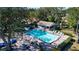 Aerial view of refreshing community pool with lounge chairs at 5807 Garden Lakes Fern # 5807, Bradenton, FL 34203