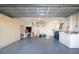 Two-car garage with washer, dryer, and ample storage shelving at 5807 Garden Lakes Fern # 5807, Bradenton, FL 34203