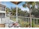 Balcony view of a lush lawn and landscaped yard with tropical palm trees in a condominium complex at 5903 Canal Dr # I24, Bradenton, FL 34207
