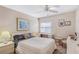 Bedroom featuring a queen bed, a ceiling fan, and a window with blinds at 5903 Canal Dr # I24, Bradenton, FL 34207