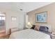 Comfortable bedroom with neutral walls, a queen size bed, and ensuite bathroom access at 5903 Canal Dr # I24, Bradenton, FL 34207