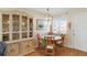 Bright dining area featuring a round table, bamboo chairs, and a hutch, ideal for entertaining and everyday meals at 5903 Canal Dr # I24, Bradenton, FL 34207