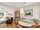 Cozy dining area with a round table, chandelier, and a decorative china cabinet, perfect for intimate meals and gatherings at 5903 Canal Dr # I24, Bradenton, FL 34207
