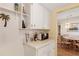 Well-equipped kitchen with open shelving and appliances, next to dining area for cooking and dining with ease at 5903 Canal Dr # I24, Bradenton, FL 34207