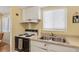 Efficient kitchen with ample counter space, white cabinets, and appliances, ideal for preparing meals at 5903 Canal Dr # I24, Bradenton, FL 34207