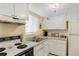 Functional kitchen featuring white cabinets and appliances, offering a practical cooking space and lots of storage at 5903 Canal Dr # I24, Bradenton, FL 34207