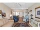 Open living room with dining area, ceiling fan, and cozy seating, perfect for relaxing and entertaining guests at 5903 Canal Dr # I24, Bradenton, FL 34207