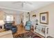 Inviting living room with a ceiling fan, comfortable seating, and a seamless flow into the dining area at 5903 Canal Dr # I24, Bradenton, FL 34207