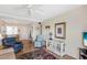 Comfortable living room features a ceiling fan, and cozy seating with easy access to the dining area at 5903 Canal Dr # I24, Bradenton, FL 34207