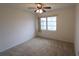 Simple bedroom with neutral decor and ceiling fan at 5904 17Th W St # C34, Bradenton, FL 34207