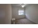 Cozy bedroom with neutral carpeting and ample closet space at 5904 17Th W St # C34, Bradenton, FL 34207