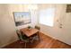 Small dining area with hardwood floors and a window at 5904 17Th W St # C34, Bradenton, FL 34207