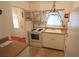 Efficient kitchen with white cabinets and appliances at 5904 17Th W St # C34, Bradenton, FL 34207