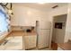 Efficient kitchen with white cabinets and appliances at 5904 17Th W St # C34, Bradenton, FL 34207