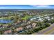 Aerial view of the community showcasing well-maintained properties, lush greenery, and serene lakes at 6706 Fairway Gardens Dr # 6706, Bradenton, FL 34203