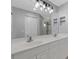 Modern bathroom with dual sinks, large mirror, and modern lighting at 6706 Fairway Gardens Dr # 6706, Bradenton, FL 34203
