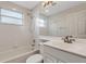 Bright bathroom with a shower-tub combo and a large mirror above a modern vanity sink at 6706 Fairway Gardens Dr # 6706, Bradenton, FL 34203