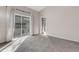 Bedroom featuring neutral carpet and a sliding door leading to an outdoor patio area at 6706 Fairway Gardens Dr # 6706, Bradenton, FL 34203