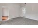 Bedroom featuring neutral carpet and doors leading to a bathroom and another room at 6706 Fairway Gardens Dr # 6706, Bradenton, FL 34203