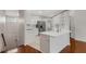 Bright kitchen features modern appliances and white cabinets and a large sink at 6706 Fairway Gardens Dr # 6706, Bradenton, FL 34203
