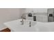 Stainless steel faucet with white countertop and appliances in this bright kitchen at 6706 Fairway Gardens Dr # 6706, Bradenton, FL 34203