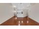 This expansive living room features hardwood floors and connects to a modern kitchen at 6706 Fairway Gardens Dr # 6706, Bradenton, FL 34203