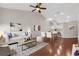 This bright living room features hardwood floors and flows into a modern kitchen at 6706 Fairway Gardens Dr # 6706, Bradenton, FL 34203