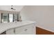 Bright living room with ceiling fan, double sink, and hardwood floors at 6706 Fairway Gardens Dr # 6706, Bradenton, FL 34203